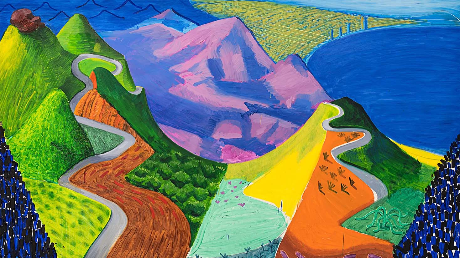 A colorful landscape depicts winding roads and an ocean